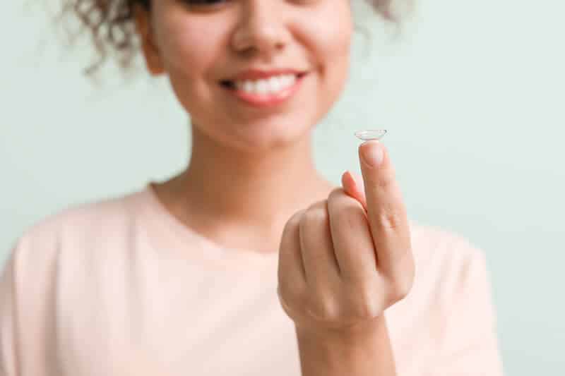 Woman Holding a Contact Lens